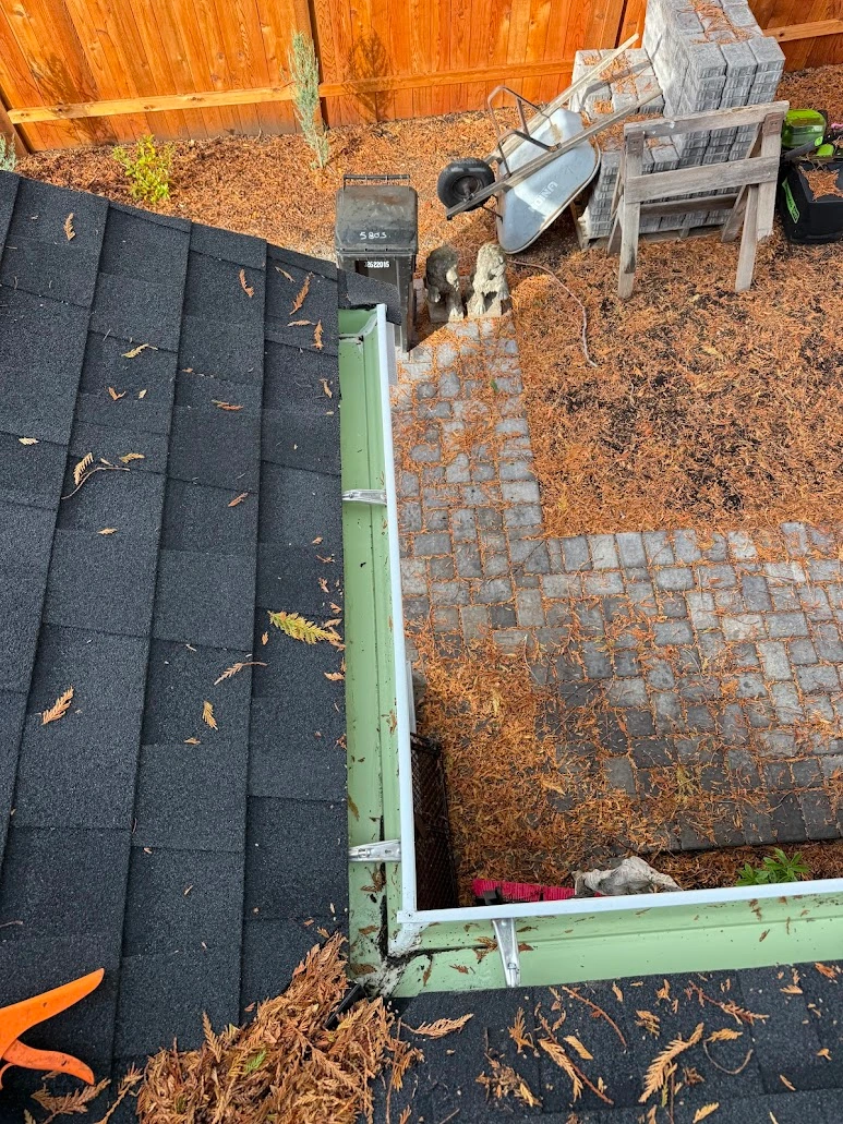 Seattle gutter corner cleared and flowing after cleaning