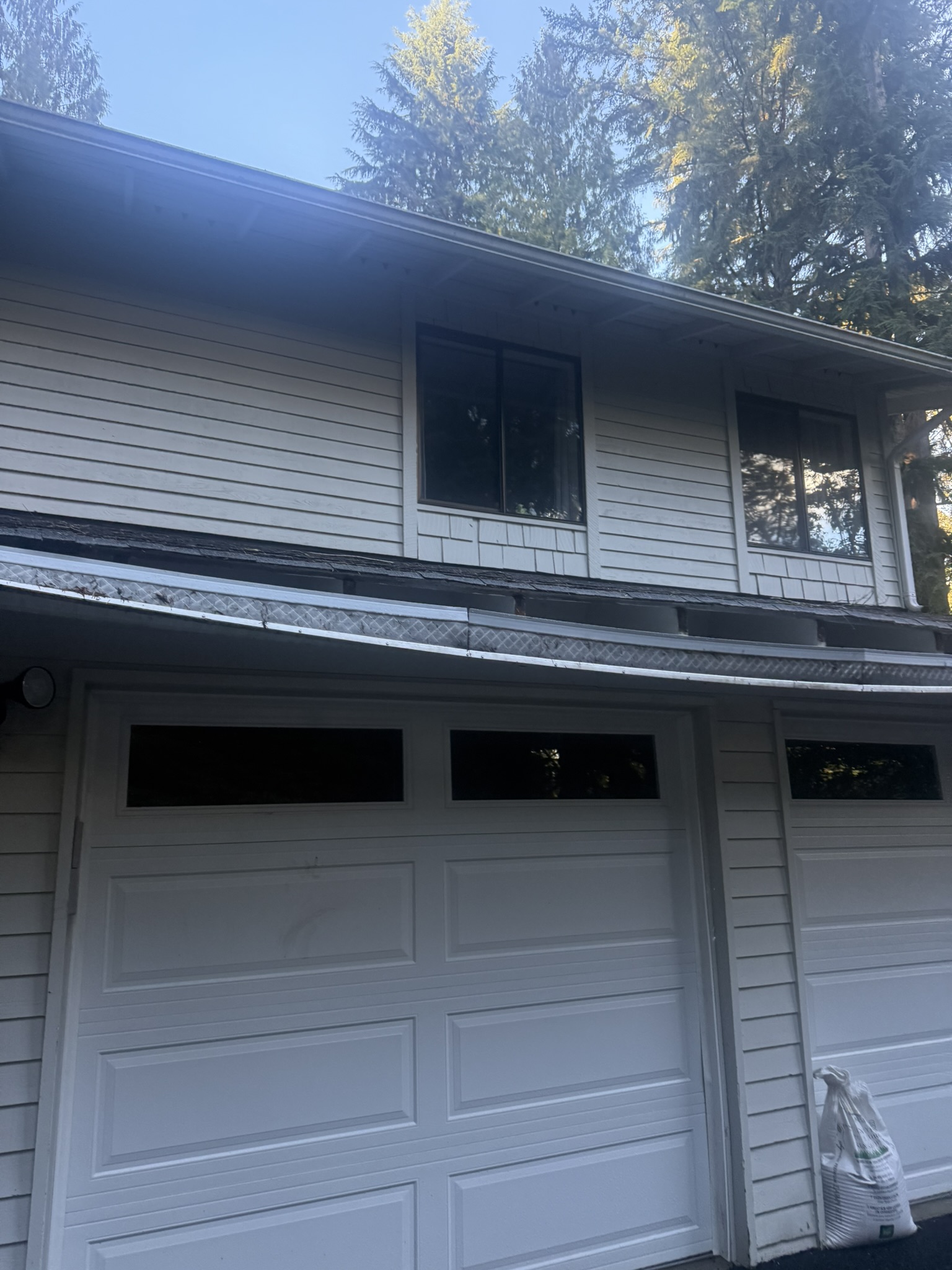 Loose gutter and failing attachment before correction.