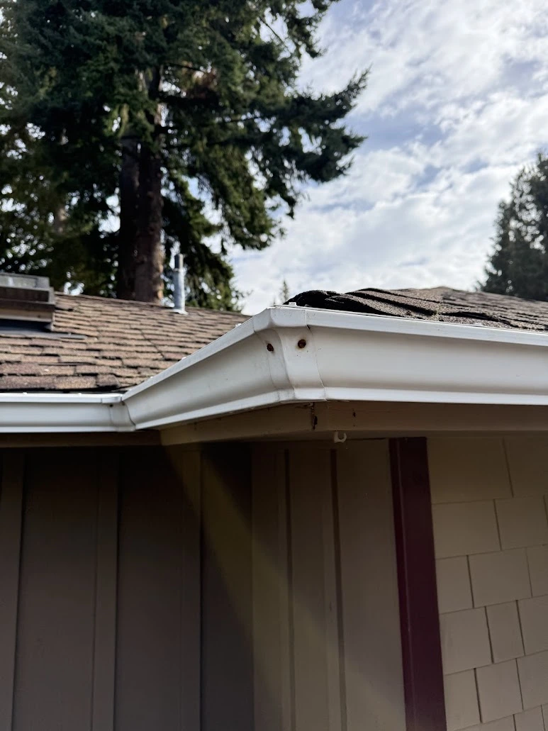 Loose gutter brackets before hardware replacement in Lynnwood